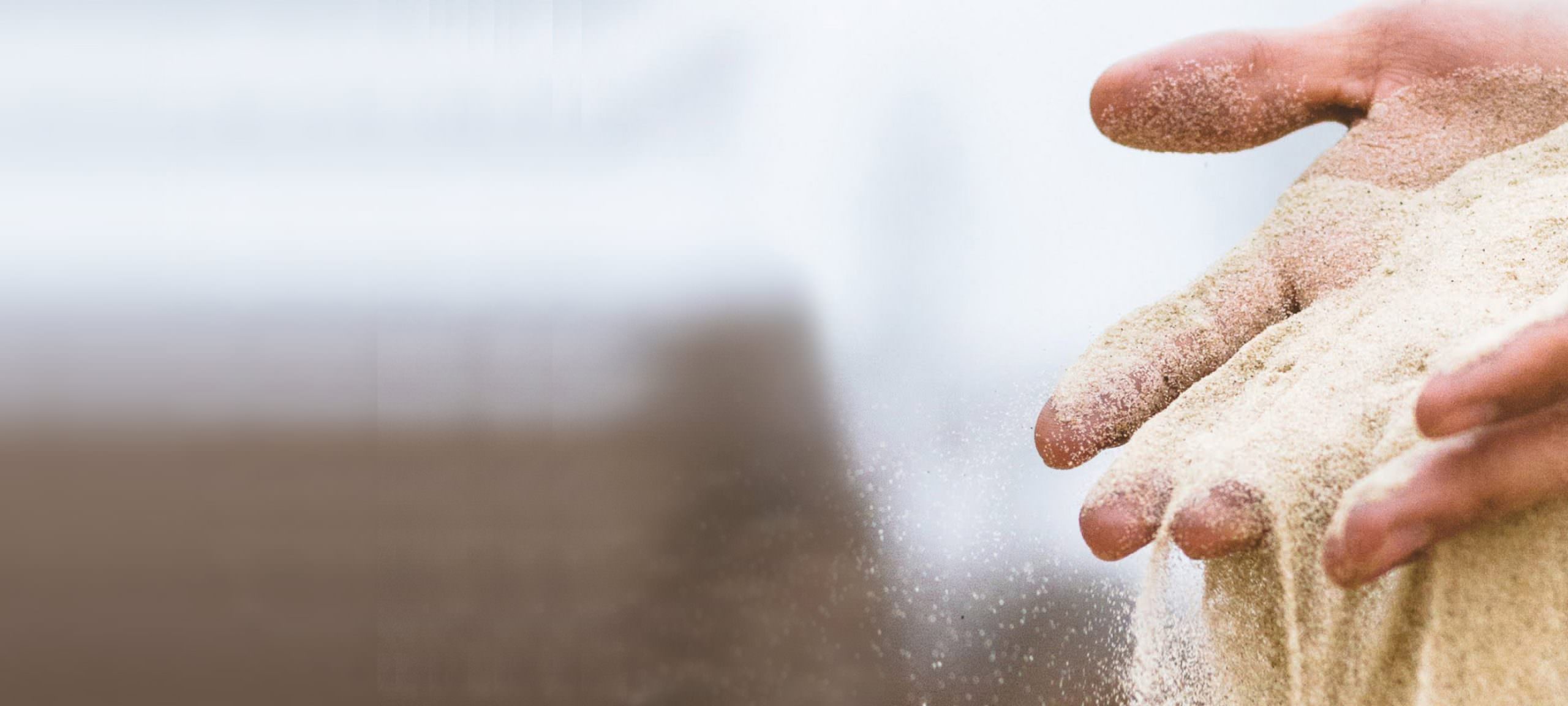Sand running between a pair of hands
